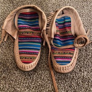 Leather serape fringe moccasins.